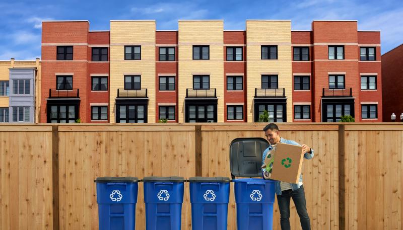 Man recycling outside his apartment