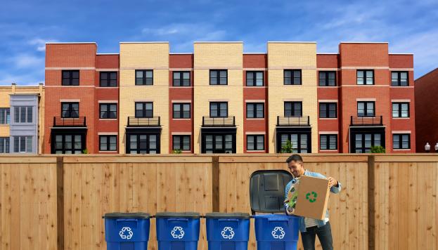 Man recycling outside his apartment